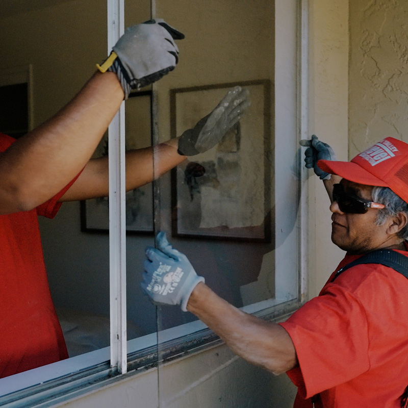 people installing a window