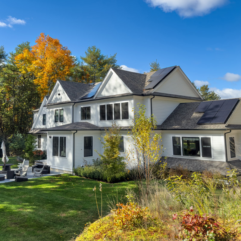 a white house in the fall